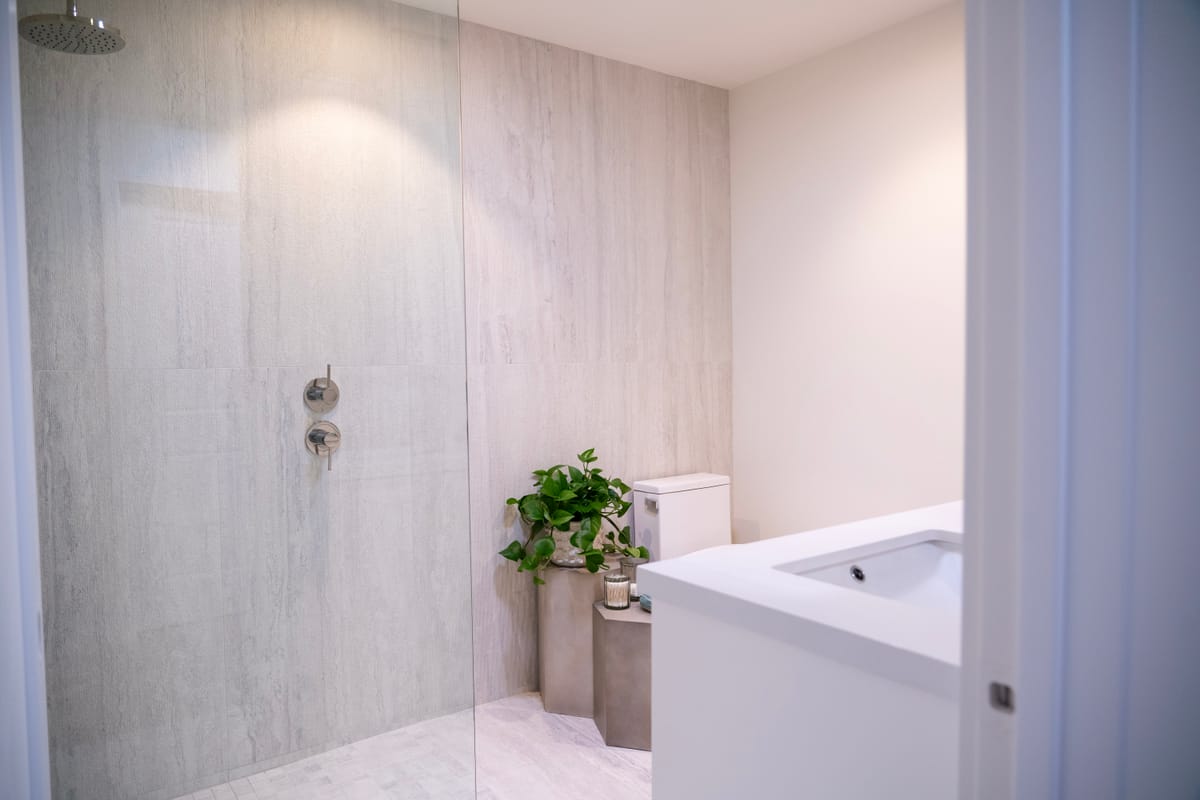 Spa bathroom with full-height stone and a walk-in shower